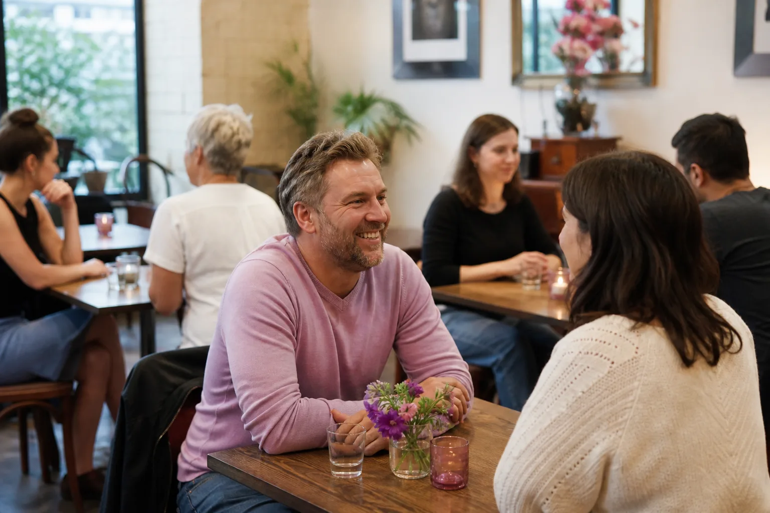 People talking over drinks at a speed dating event in Canterbury, Kent