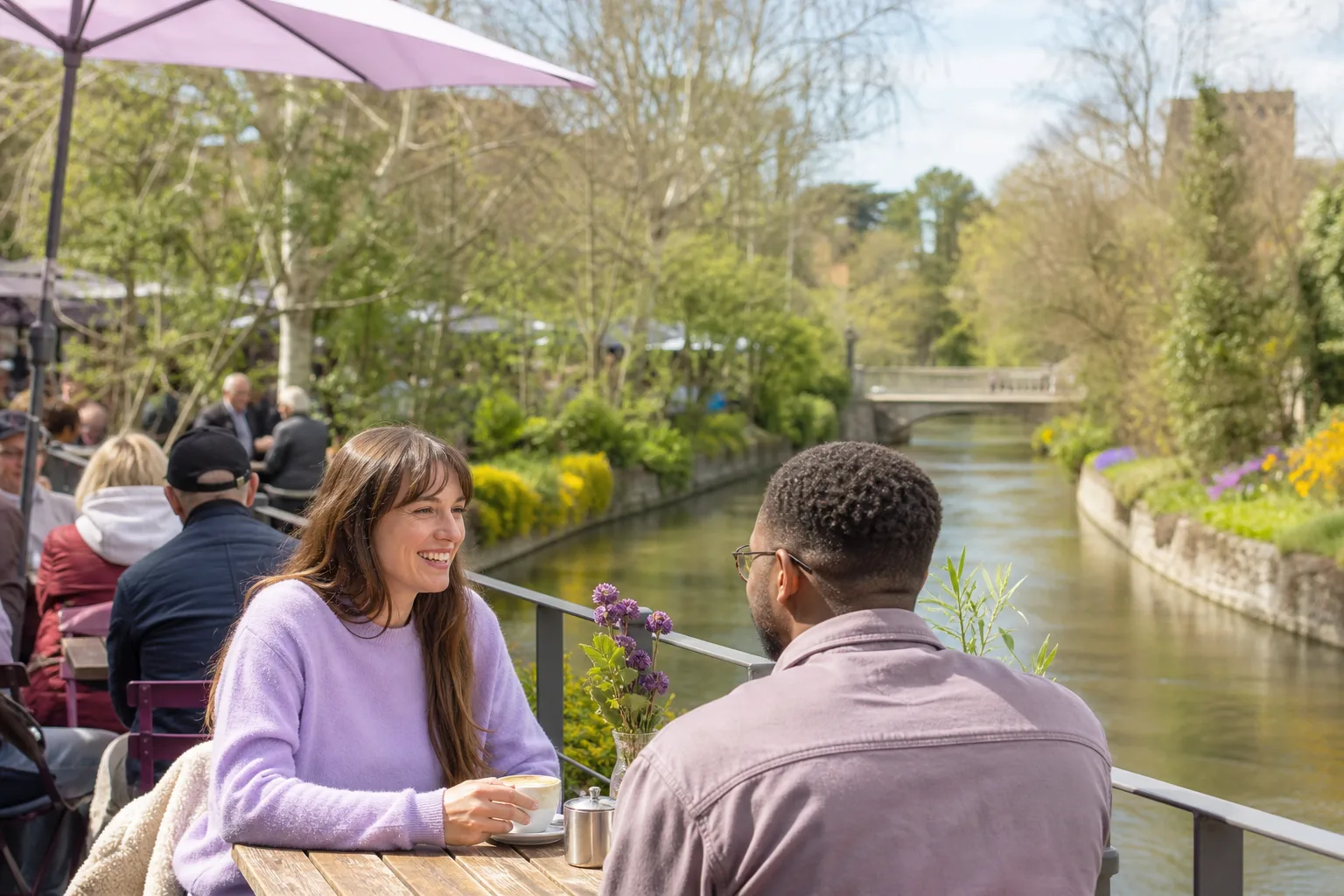 Couple walking beside the River Stour in Westgate Gardens, Canterbury